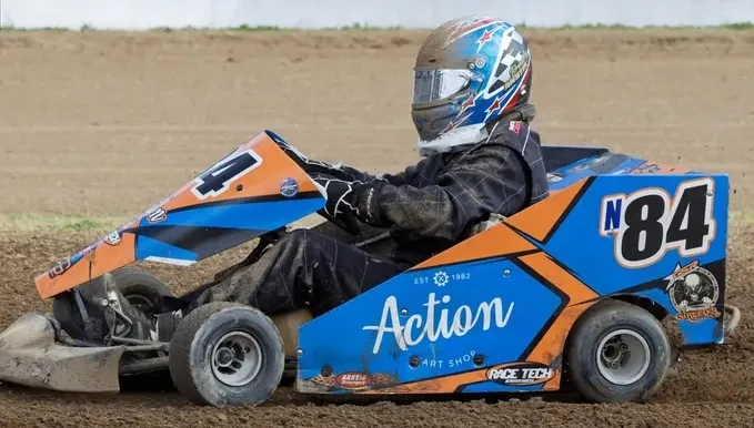 Bradley Anstis #84 125cc speedway kart racing on dirt oval — Anstis Motorsport